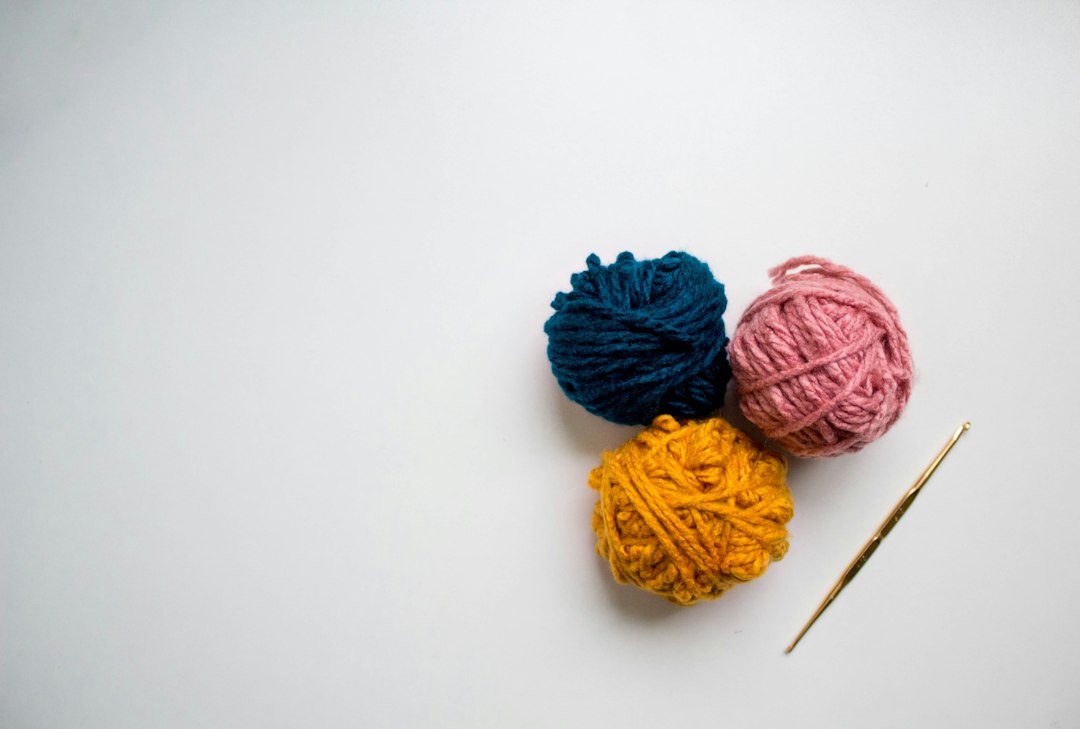 Colorful yarn and handmade craft supplies for crochet keychains