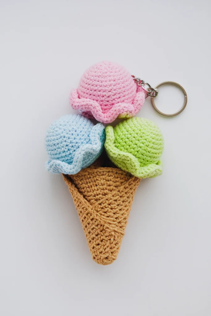 A crochet keychain of an ice cream cone 6lpgH19SVHWtr6OyYTzrvg oOg4gKbRH258YM8cZnvlA cover